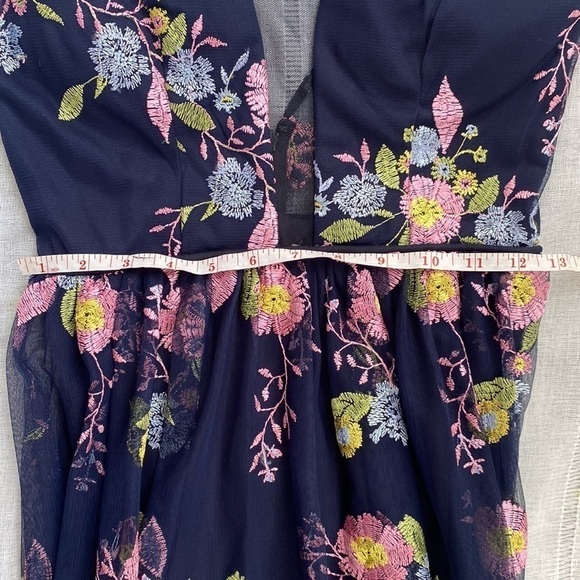 GB formal gown in navy with embroidered pink, yellow, and blue flowers. - Picture 15 of 15